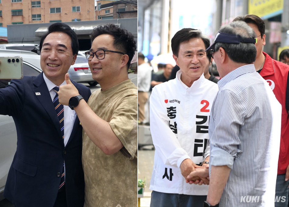 박수현 더불어민주당 충남도지사 후보(왼쪽)와 김태흠 국민의힘 후보가 유권자들을 만나 한표를 호소하고 있다.